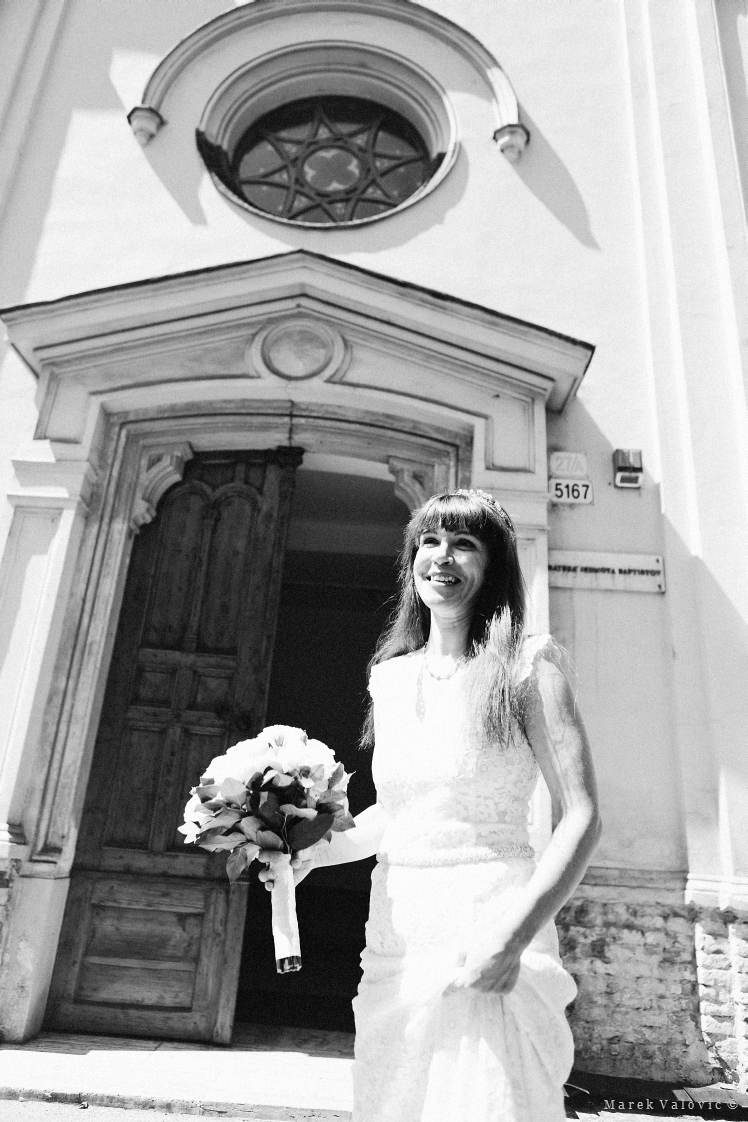 wedding in baptism church in Bratislava - bride in front of the church