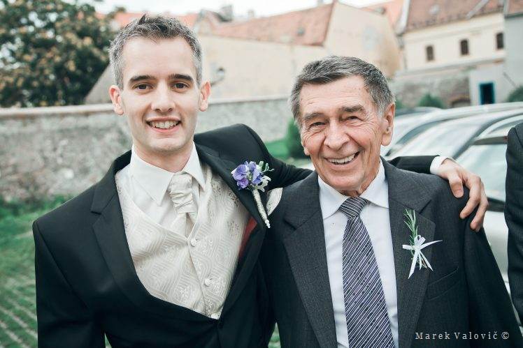 groom posing with grand parent