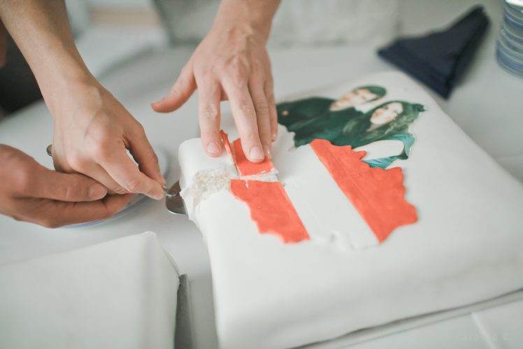 cutting wedding cake as Austrian flag