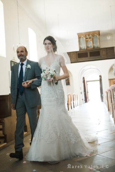bride with father entering church - inside church