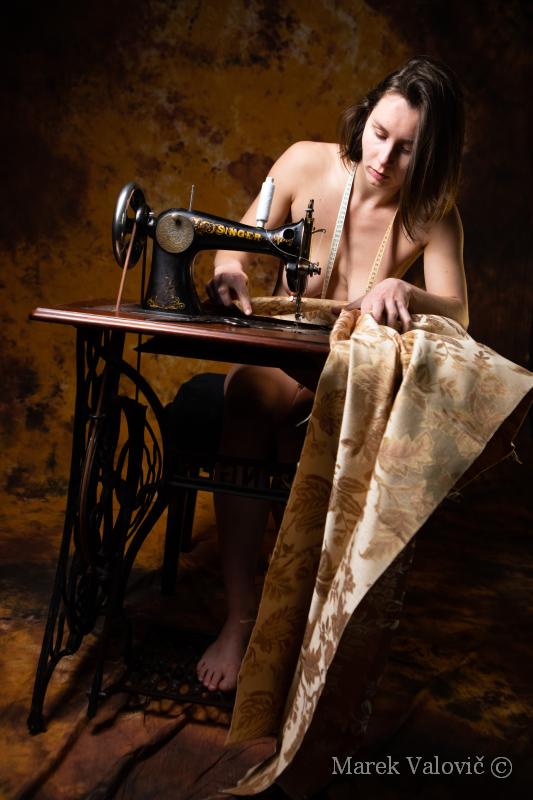 nude woman sewing on vintage mashine | reference for artists