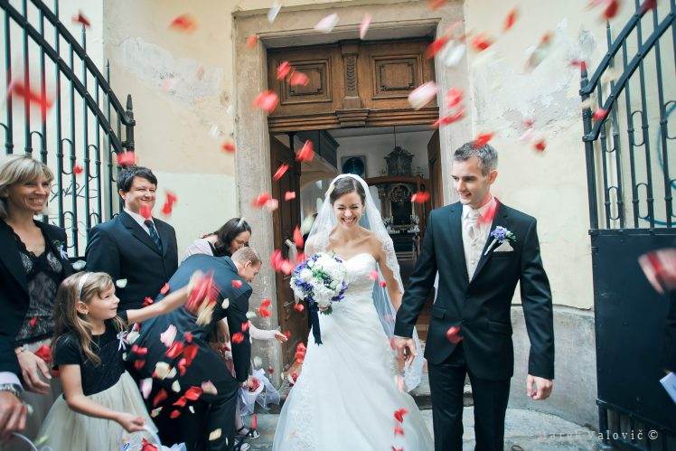 bride and groom - throwing flower petals
